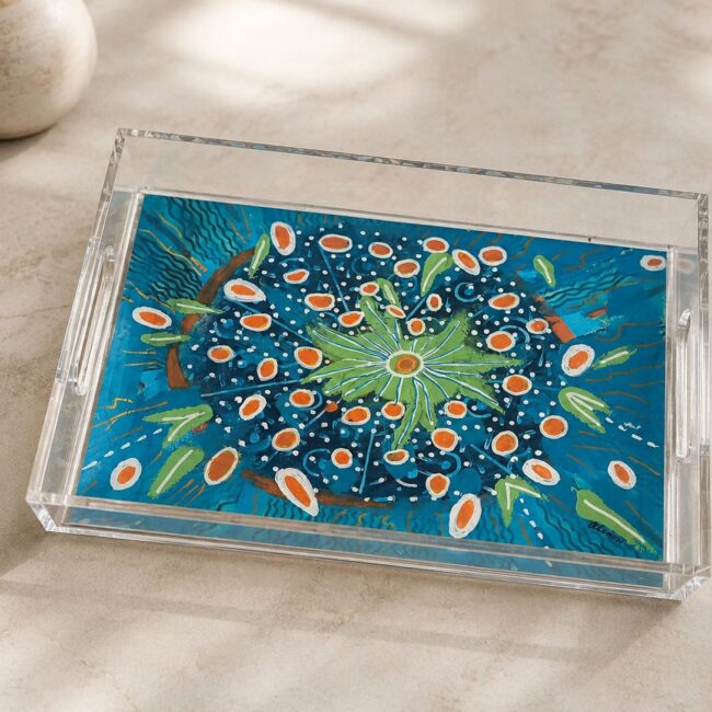 Decorative acrylic tray by Greek artist Aglaia Leoussi, featuring a vibrant blue floral artwork with orange, green, and white details