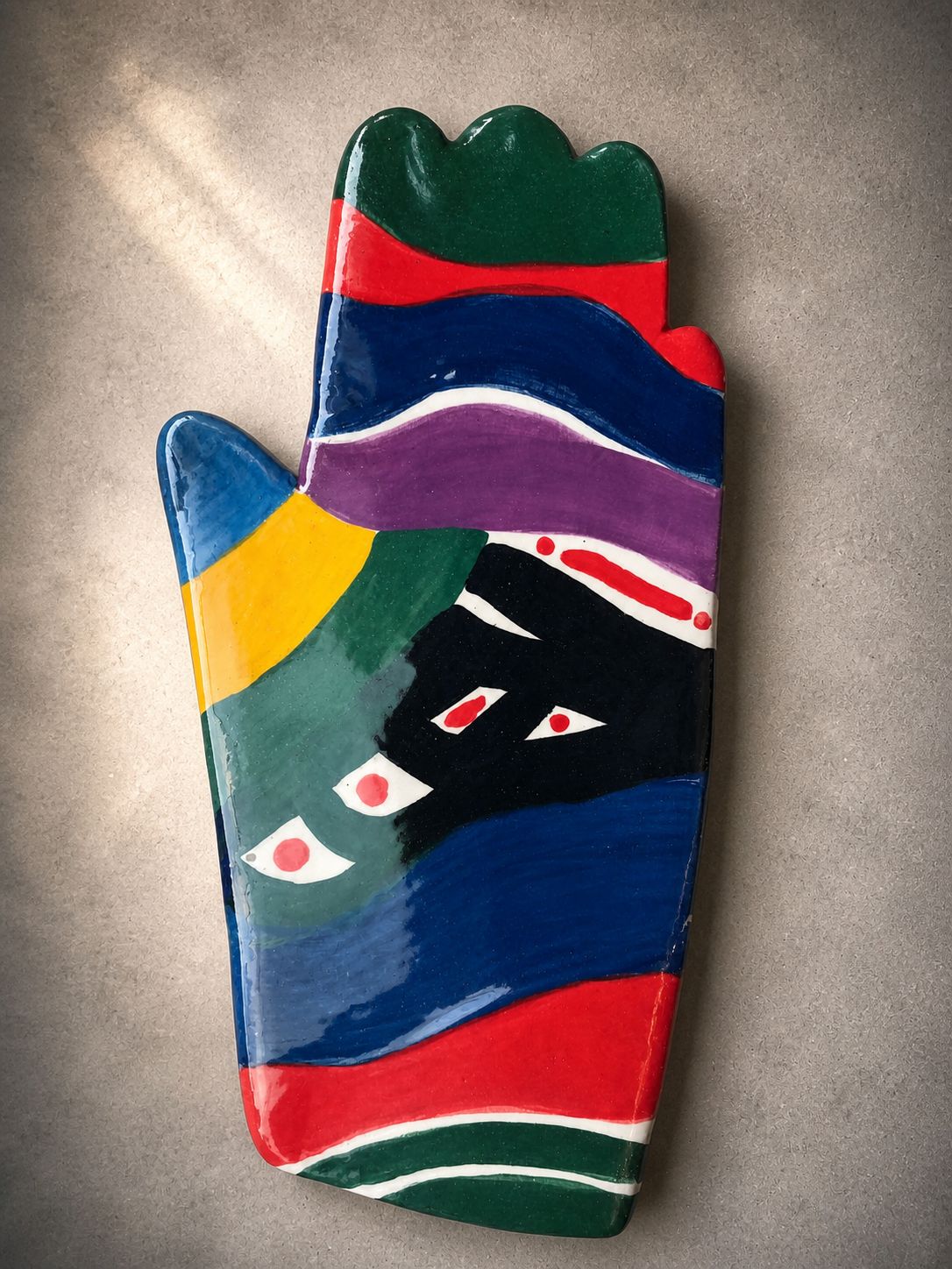 Happy Hands ceramic artwork by Greek artist Aglaia Leoussi, featuring a colorful hand-shaped sculpture with abstract painted patterns