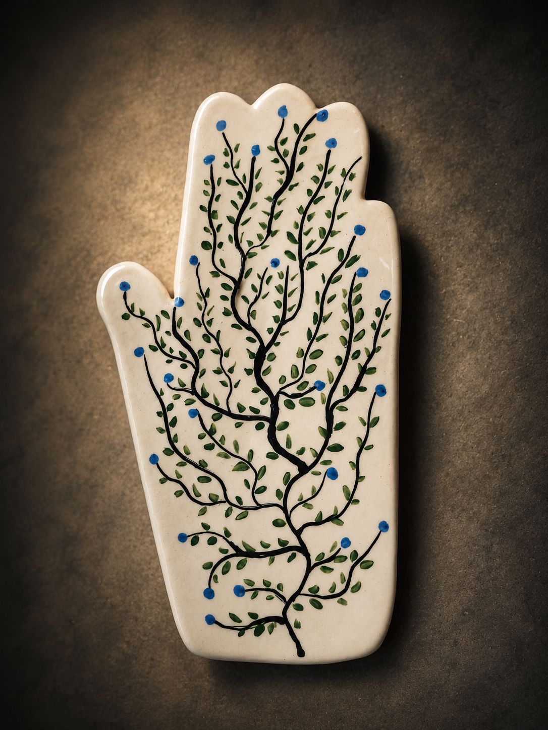 Happy Hands ceramic artwork by Greek artist Aglaia Leoussi, featuring a colorful hand-shaped sculpture with abstract painted patterns
