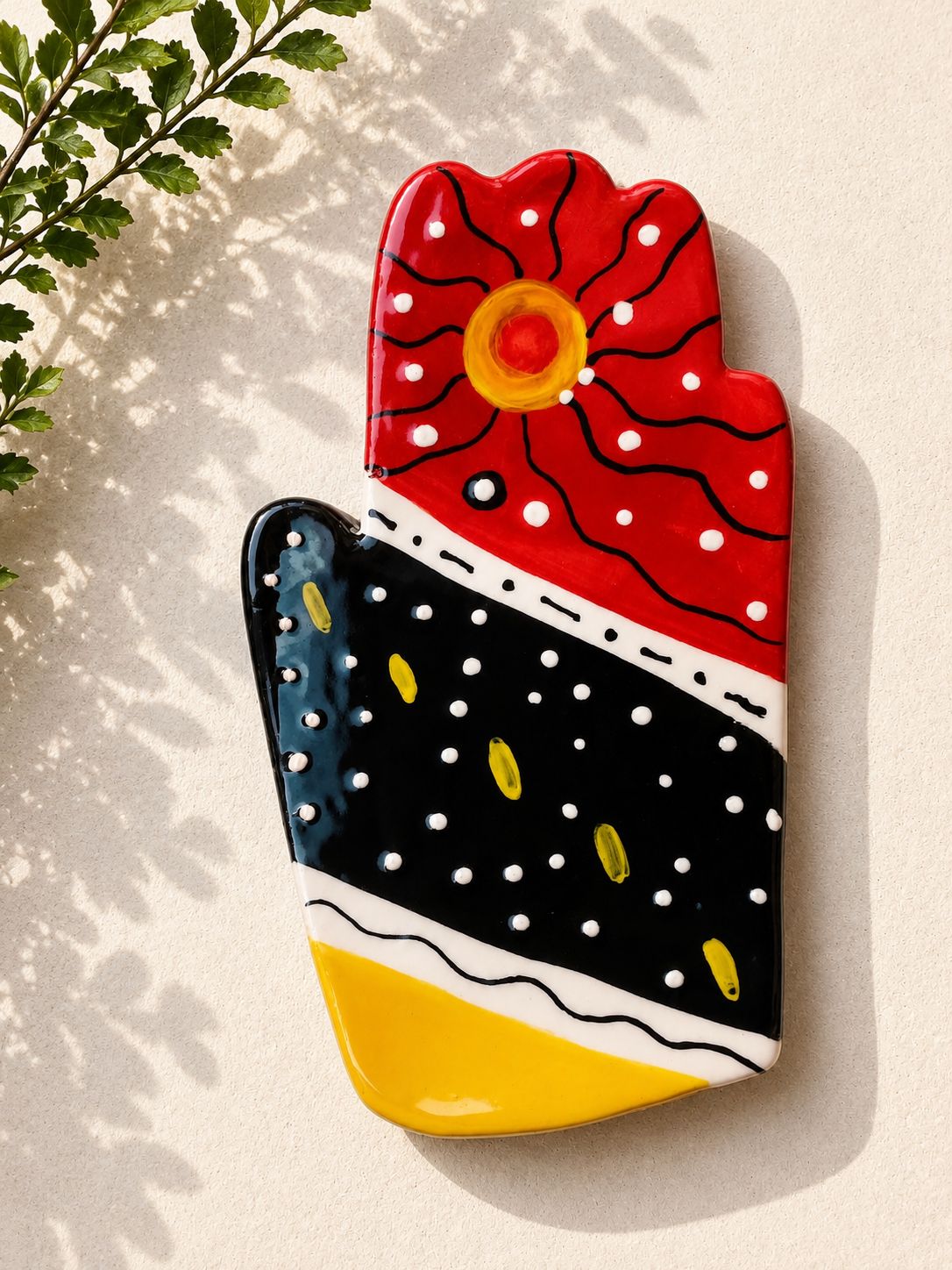 Happy Hands ceramic artwork by Greek artist Aglaia Leoussi, featuring a colorful hand-shaped sculpture with abstract painted patterns