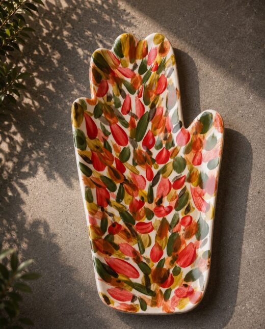 Happy Hands ceramic artwork by Greek artist Aglaia Leoussi, featuring a colorful hand-shaped sculpture with abstract painted patterns