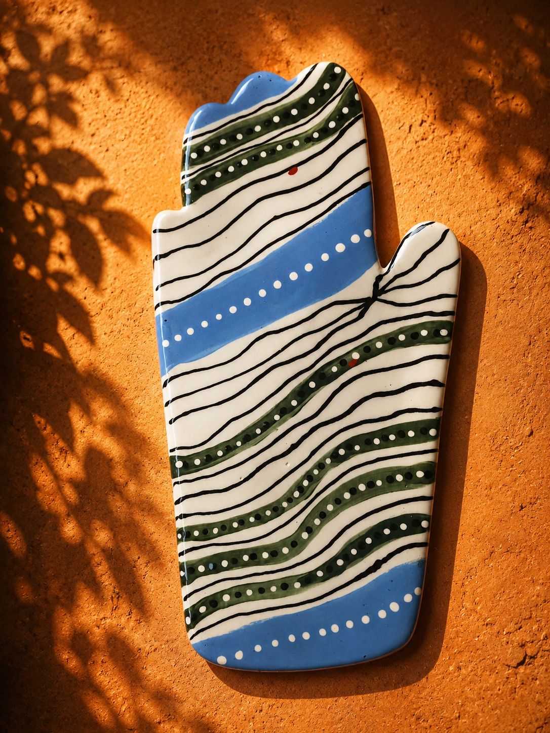 Happy Hands ceramic artwork by Greek artist Aglaia Leoussi, featuring a colorful hand-shaped sculpture with abstract painted patterns