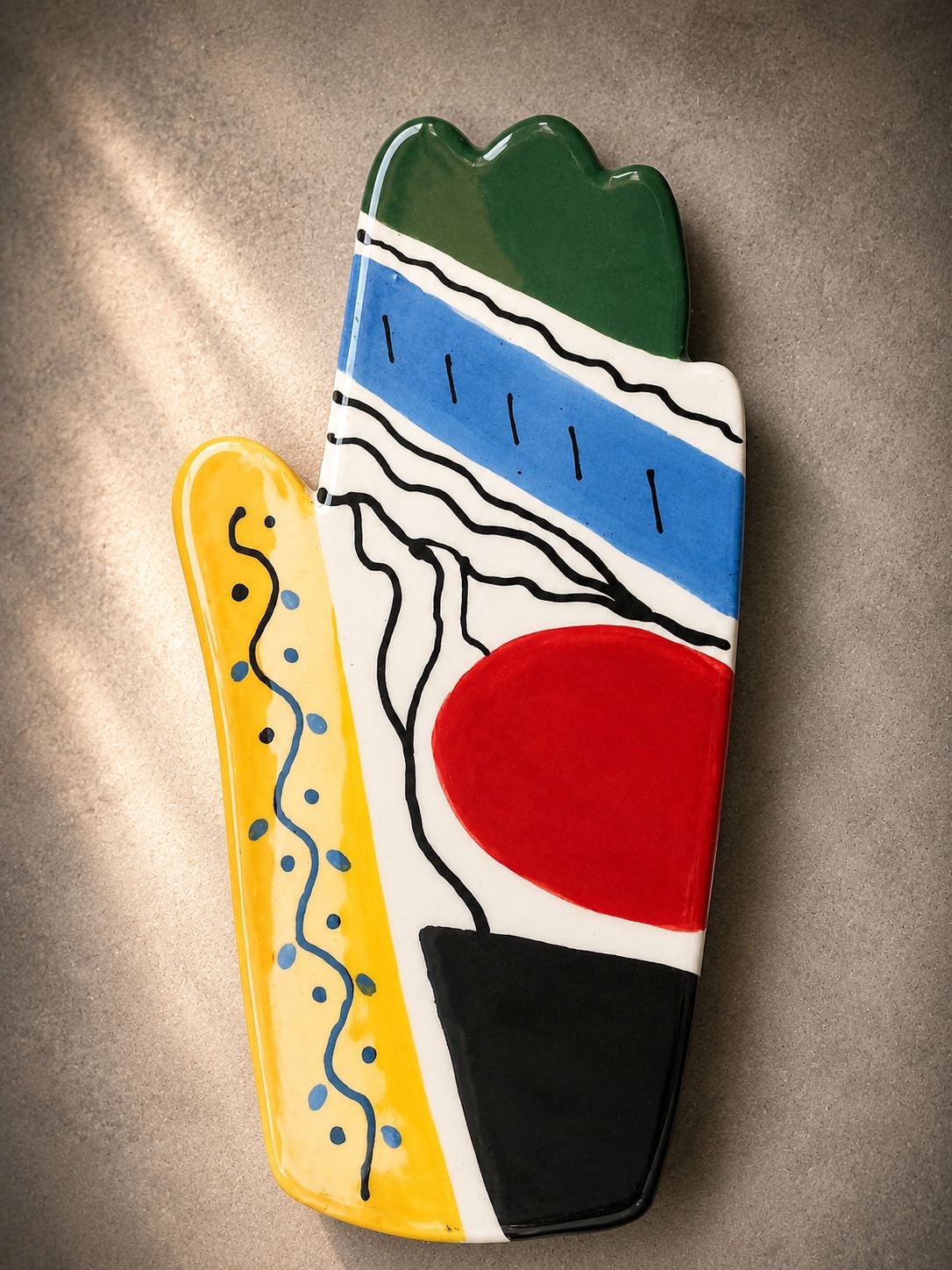 Happy Hands ceramic artwork by Greek artist Aglaia Leoussi, featuring a colorful hand-shaped sculpture with abstract painted patterns