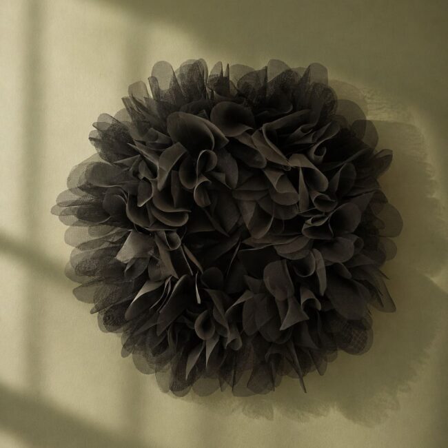 Cloud by Mistake by Aglaia Leoussi, a dark sculptural wall artwork made from reused window screen material